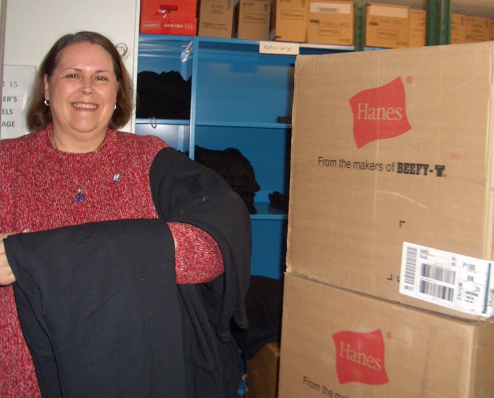 Leta unpacking a shipment of sweats