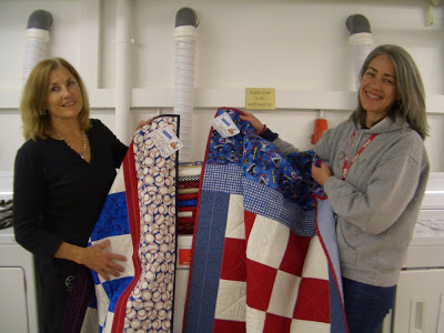 Unpacking quilts donated to Soldiers' Angels Germany