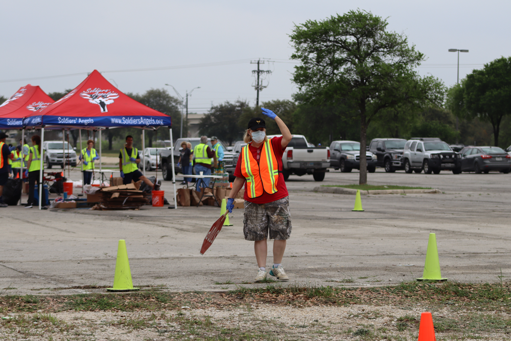 Pat directing traffic at San Antonio Mobile Food Distribution