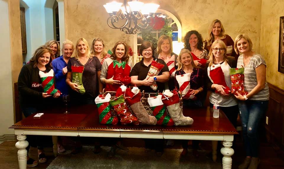 Cookie Bandits with their stockings for troops in 2019.