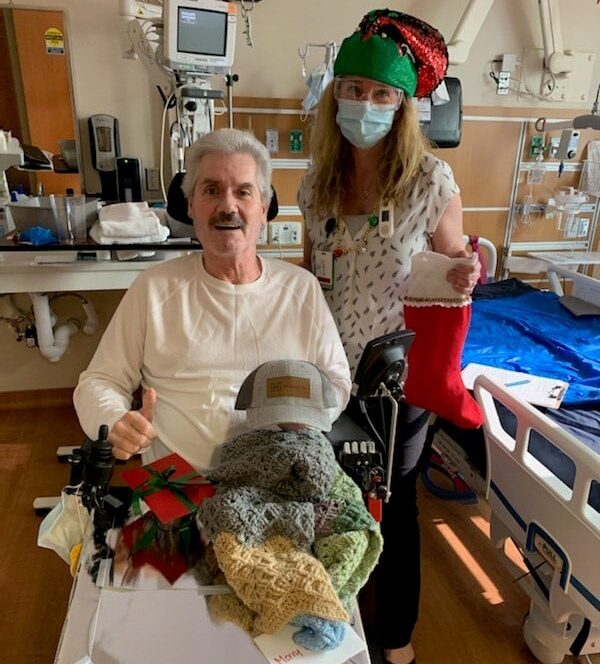 Distributing holiday stockings and care items to a veteran patient