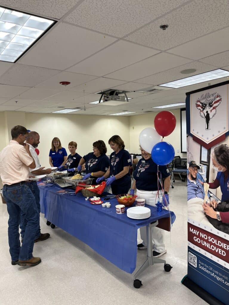 Soldiers' Angels volunteers served the meal to the attending friends and family at the 100th birthday celebration.