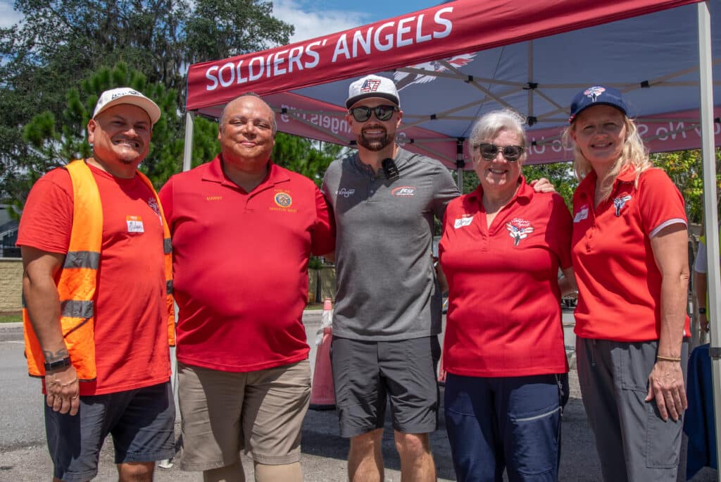 The Soldiers' Angels Orlando team and Kroger Racing's Ricky Stenhouse Jr.