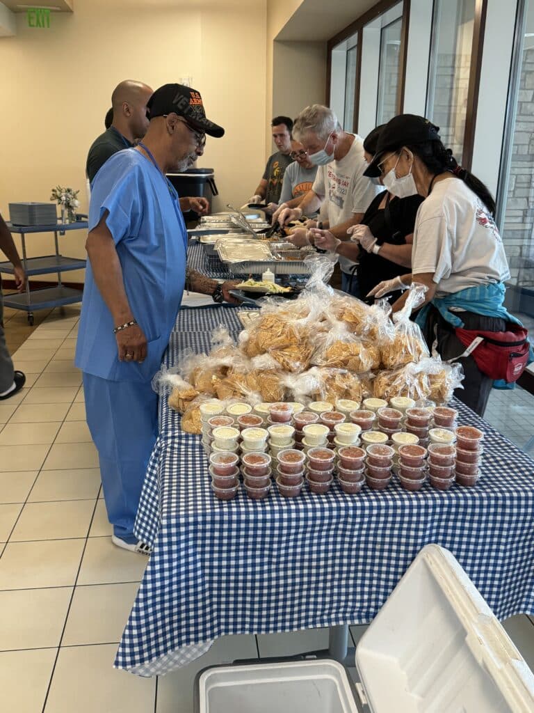 Volunteers serve Veterans lunch at the Orlando domiciliary.