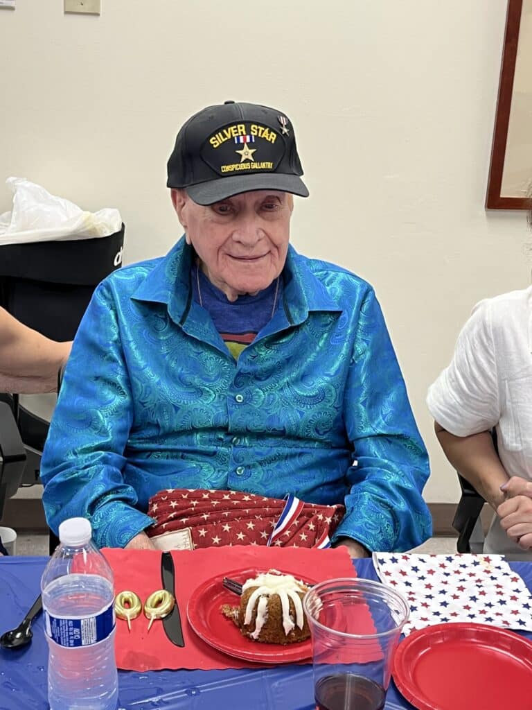 Mr. Russel getting ready to eat his 100th birthday cake.