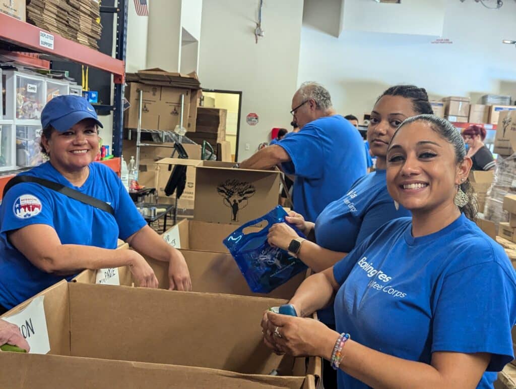 Volunteers from Boeing packing hygiene kits.