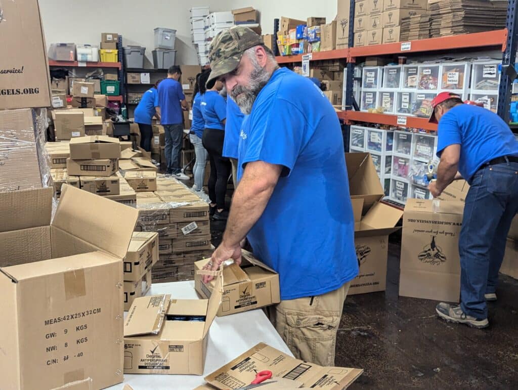 Boeing employees working hard at the Soldiers' Angels warehouse!