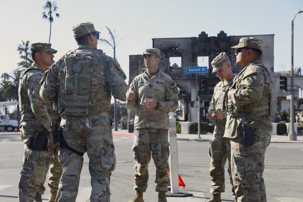 U.S. Army Capt. Benjamin Hewitt, commander of the 40th Military Police Company receives updates from his Soldiers at a traffic control point on Sunset Blvd, Pacific Palisades, Calif., on Jan.13, 2025. As of today, the Palisades Fire has burned 23,713 acres, and is 14% contained (U.S. Army National Guard Photo by Spc. Yancy Mendoza.)