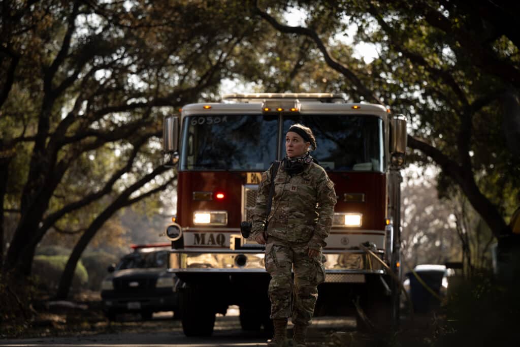 Photo by Tech. Sgt. Joseph Pagan, 163rd Attack Wing. Captain Callie Hewitt, a Public Affairs Officer assigned to March Air Reserve Base, documents fire suppression efforts against the Eaton Fire in Los Angeles, Calif., on Jan. 11, 2025.